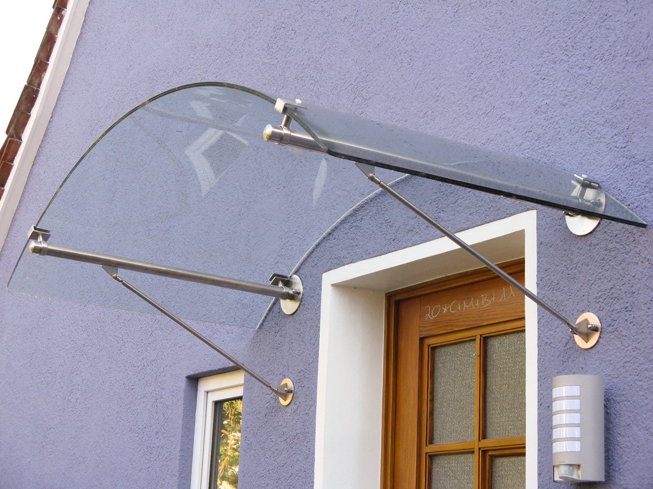 Rundbogen Edelstahlvordach Zuerich
